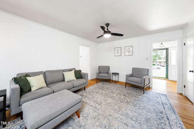 5203 Shady Bluff St, Durham, NC 27704 - living area featuring wood finished floors, a ceiling fan, and crown molding