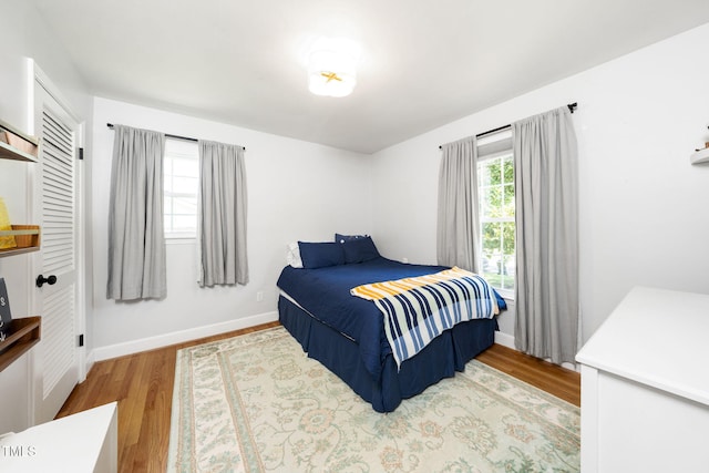 5203 Shady Bluff St, Durham, NC 27704 - bedroom with wood finished floors and baseboards
