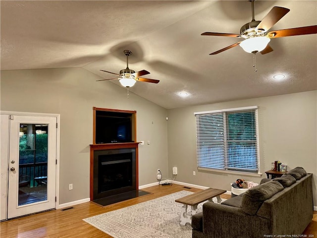 6622 Vaughn Rd, Fayetteville, NC 28304 - living room with a ceiling fan, wood finished floors, a fireplace with flush hearth, lofted ceiling, and recessed lighting