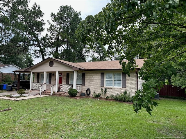 6622 Vaughn Rd, Fayetteville, NC 28304 - ranch-style house featuring brick siding and a porch