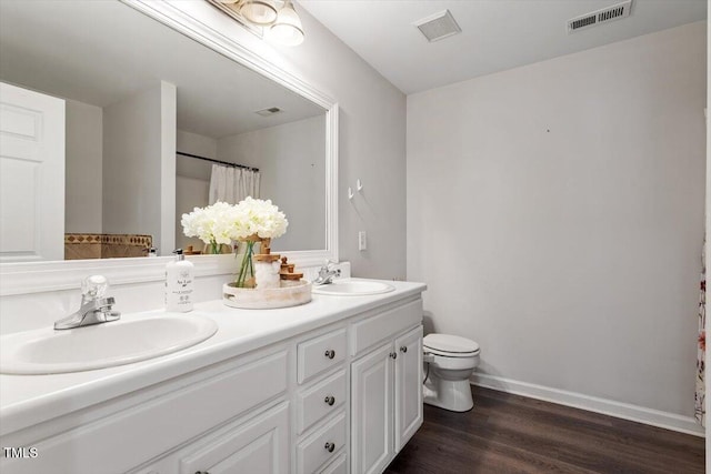 1643 Southcross St, Fuquay Varina, NC 27526 - full bathroom featuring double vanity, wood finished floors, and a shower with curtain