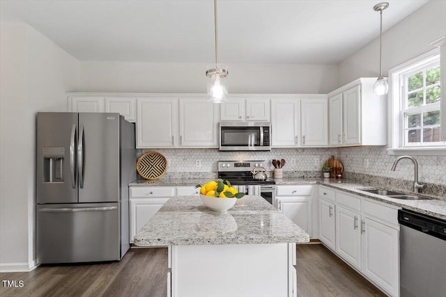 1643 Southcross St, Fuquay Varina, NC 27526 - kitchen with stainless steel appliances, white cabinets, and a kitchen island