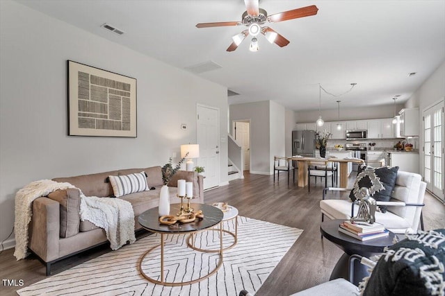 1643 Southcross St, Fuquay Varina, NC 27526 - living room with stairway, wood finished floors, and ceiling fan
