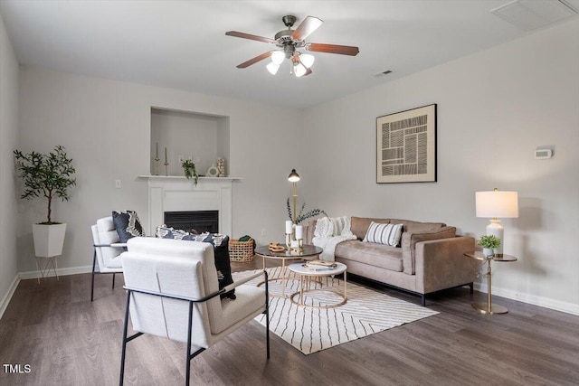 1643 Southcross St, Fuquay Varina, NC 27526 - living room featuring wood finished floors, a ceiling fan, and a fireplace