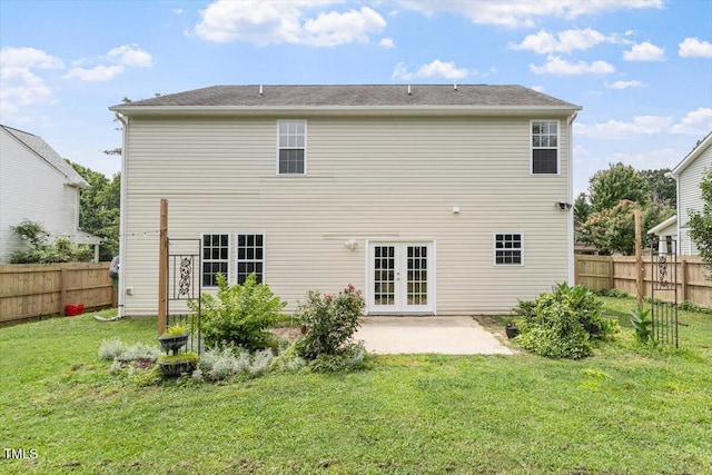 1643 Southcross St, Fuquay Varina, NC 27526 - back of property with french doors, a patio, and a fenced backyard