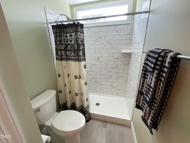 1034 Snapdragon Dr, Wake Forest, NC 27587 - bathroom featuring a stall shower and wood finished floors