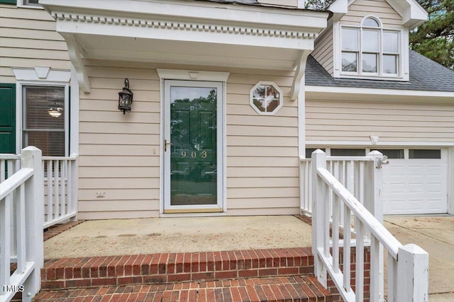 903 Norood Ln, Apex, NC 27502 - doorway to property with a shingled roof and a garage