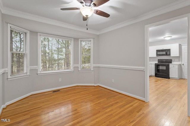 903 Norood Ln, Apex, NC 27502 - spare room with light wood-style floors, healthy amount of natural light, crown molding, and a ceiling fan