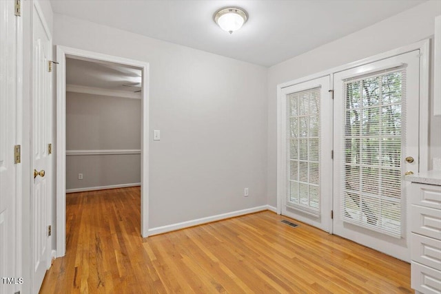 903 Norood Ln, Apex, NC 27502 - unfurnished room with light wood-style floors and crown molding