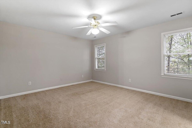 903 Norood Ln, Apex, NC 27502 - carpeted spare room featuring healthy amount of natural light and a ceiling fan