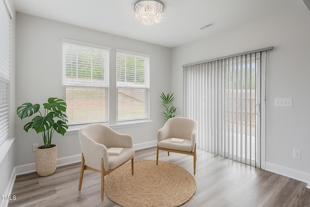 815 Harmony Ranch Ln, Franklinton, NC 27525 - living area with wood finished floors and a chandelier