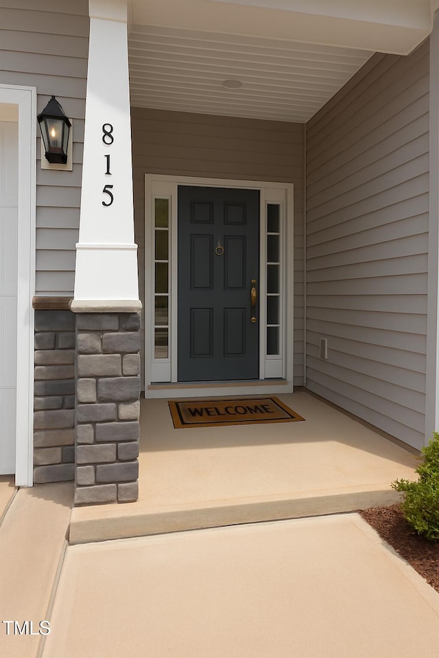 815 Harmony Ranch Ln, Franklinton, NC 27525 - property entrance with a porch and stone siding