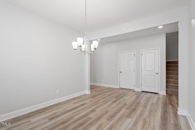 815 Harmony Ranch Ln, Franklinton, NC 27525 - unfurnished room featuring light wood-type flooring, a chandelier, stairway, and recessed lighting
