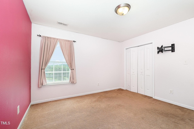 2486 Ingleside Dr, High Point, NC 27265 - unfurnished bedroom featuring carpet flooring and a closet