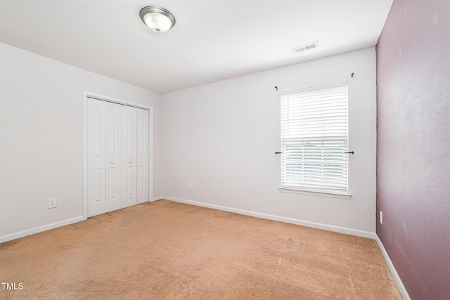 2486 Ingleside Dr, High Point, NC 27265 - unfurnished bedroom featuring light colored carpet and a closet
