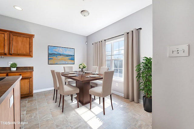 2486 Ingleside Dr, High Point, NC 27265 - dining space featuring baseboards and stone finish flooring
