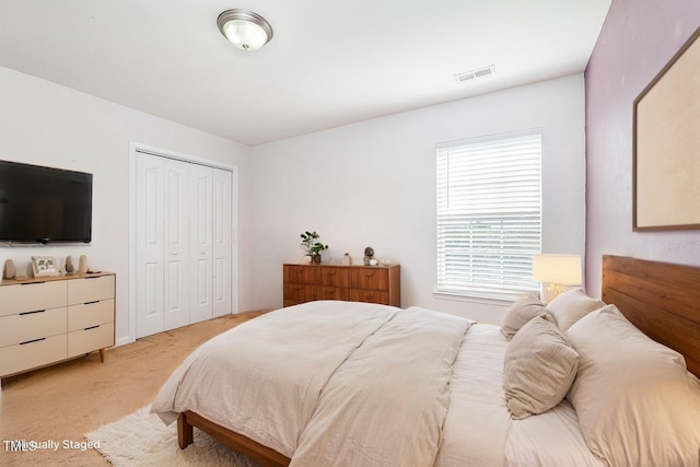 2486 Ingleside Dr, High Point, NC 27265 - bedroom featuring light carpet and a closet