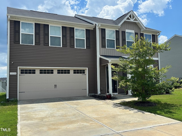 1118 Briar Rose Ln, Durham, NC 27704 - view of front of home featuring an attached garage and concrete driveway