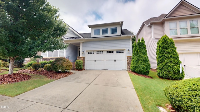 1524 Lily Creek Dr, Cary, NC 27518 - view of front of property featuring stone siding, driveway, a front lawn, a garage, and a shingled roof