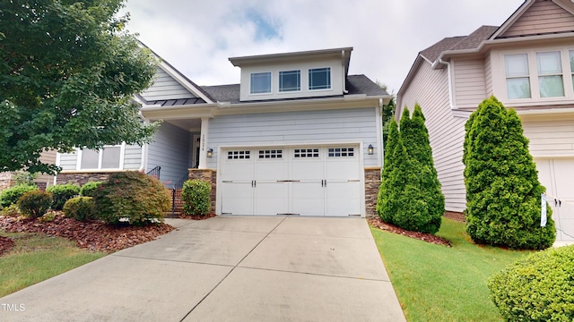 1524 Lily Creek Dr, Cary, NC 27518 - craftsman-style home featuring stone siding, concrete driveway, a front yard, a garage, and roof with shingles
