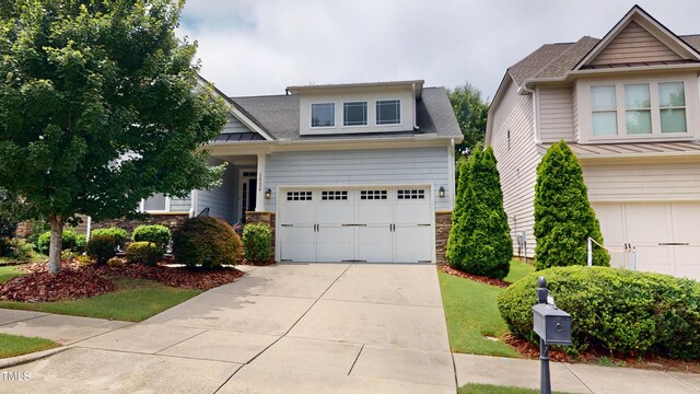 1524 Lily Creek Dr, Cary, NC 27518 - craftsman inspired home featuring stone siding, concrete driveway, an attached garage, and a shingled roof