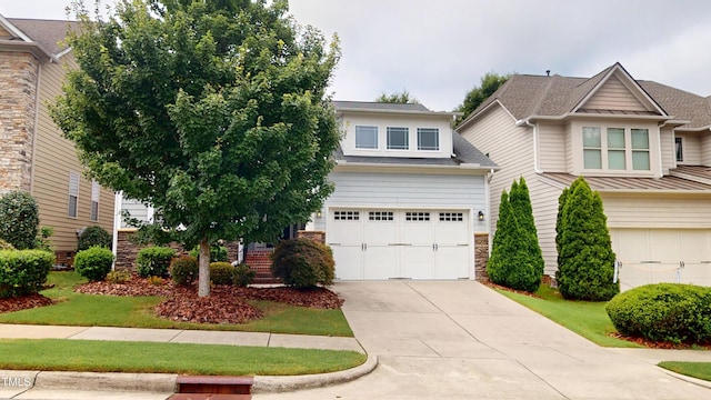 1524 Lily Creek Dr, Cary, NC 27518 - view of front of house featuring a garage, concrete driveway, and stone siding