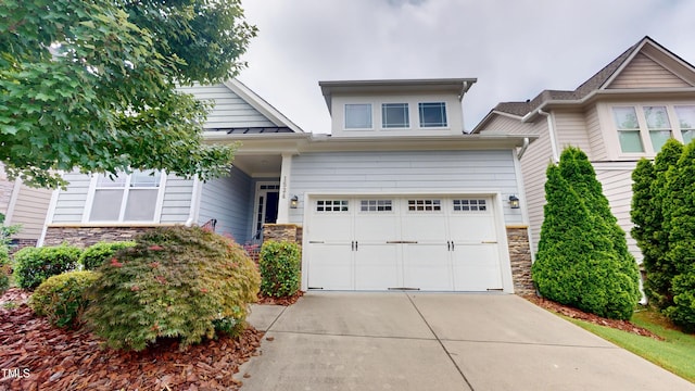 1524 Lily Creek Dr, Cary, NC 27518 - view of front of home featuring stone siding, driveway, and a garage
