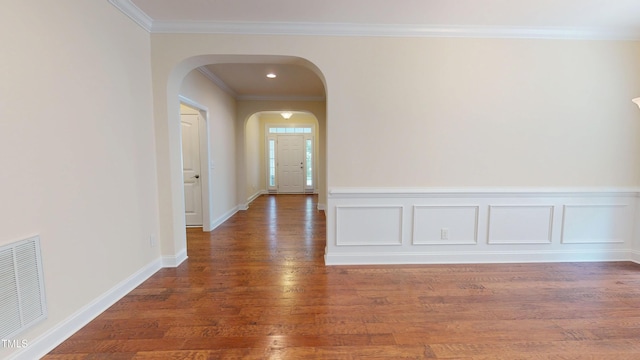 1524 Lily Creek Dr, Cary, NC 27518 - corridor with arched walkways, wood finished floors, and ornamental molding