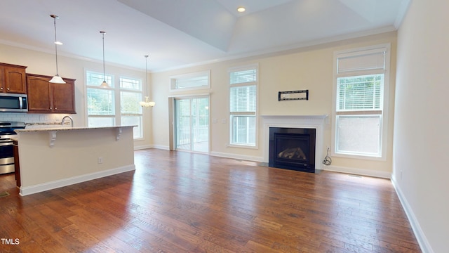 1524 Lily Creek Dr, Cary, NC 27518 - kitchen with a breakfast bar, crown molding, stainless steel appliances, tasteful backsplash, and open floor plan