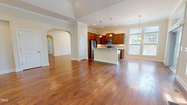 1524 Lily Creek Dr, Cary, NC 27518 - unfurnished living room featuring ornamental molding, dark wood-type flooring, arched walkways, a chandelier, and recessed lighting