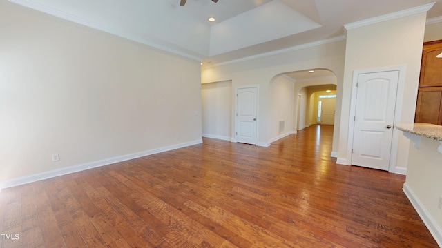 1524 Lily Creek Dr, Cary, NC 27518 - empty room featuring arched walkways, ceiling fan, ornamental molding, and dark wood-style floors