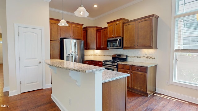 1524 Lily Creek Dr, Cary, NC 27518 - kitchen featuring appliances with stainless steel finishes, tasteful backsplash, plenty of natural light, dark wood-style flooring, and ornamental molding