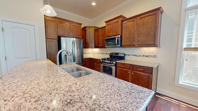 1524 Lily Creek Dr, Cary, NC 27518 - kitchen featuring appliances with stainless steel finishes, decorative backsplash, dark wood-type flooring, ornamental molding, and pendant lighting