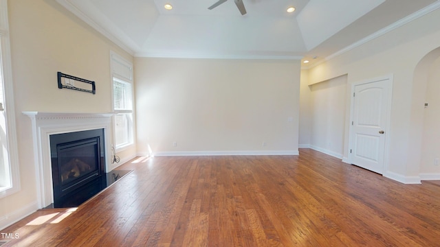 1524 Lily Creek Dr, Cary, NC 27518 - unfurnished living room with a glass covered fireplace, a ceiling fan, hardwood / wood-style floors, arched walkways, and recessed lighting