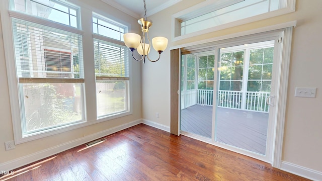1524 Lily Creek Dr, Cary, NC 27518 - unfurnished dining area featuring ornamental molding, dark wood-style flooring, and a chandelier