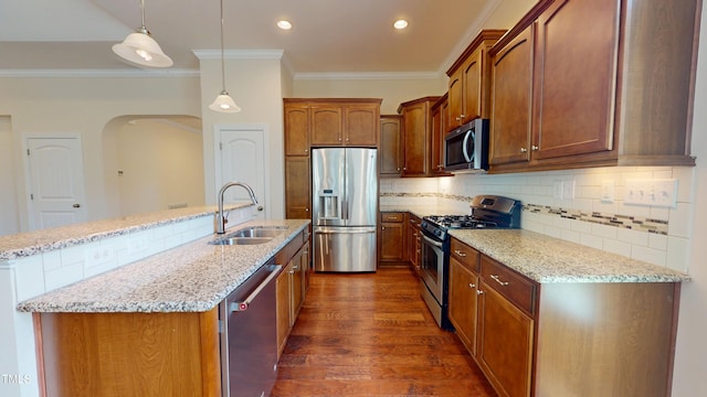 1524 Lily Creek Dr, Cary, NC 27518 - kitchen with stainless steel appliances, ornamental molding, dark wood-style floors, arched walkways, and tasteful backsplash
