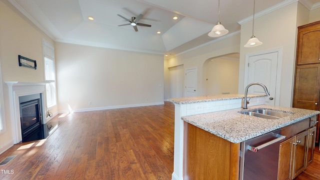 1524 Lily Creek Dr, Cary, NC 27518 - kitchen with a center island with sink, ceiling fan, stainless steel dishwasher, dark wood-style flooring, and arched walkways