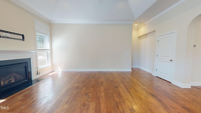 1524 Lily Creek Dr, Cary, NC 27518 - unfurnished living room with arched walkways, a glass covered fireplace, wood finished floors, crown molding, and vaulted ceiling