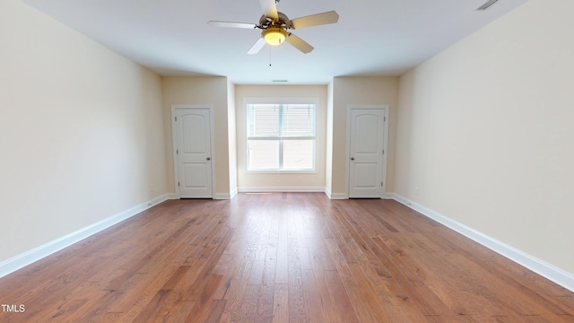 1524 Lily Creek Dr, Cary, NC 27518 - spare room featuring a ceiling fan and wood finished floors