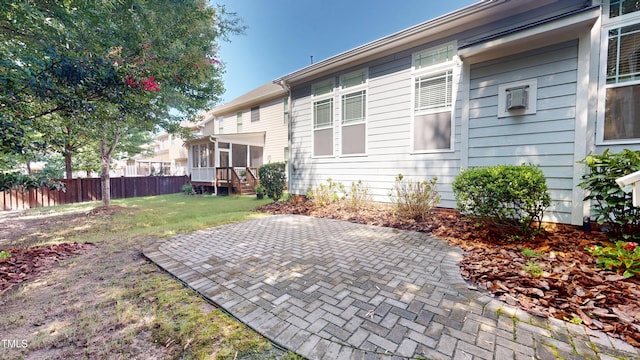 1524 Lily Creek Dr, Cary, NC 27518 - rear view of house featuring a sunroom and a patio