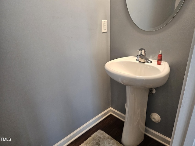 1303 Salters St, Burlington, NC 27215 - bathroom with wood finished floors and baseboards