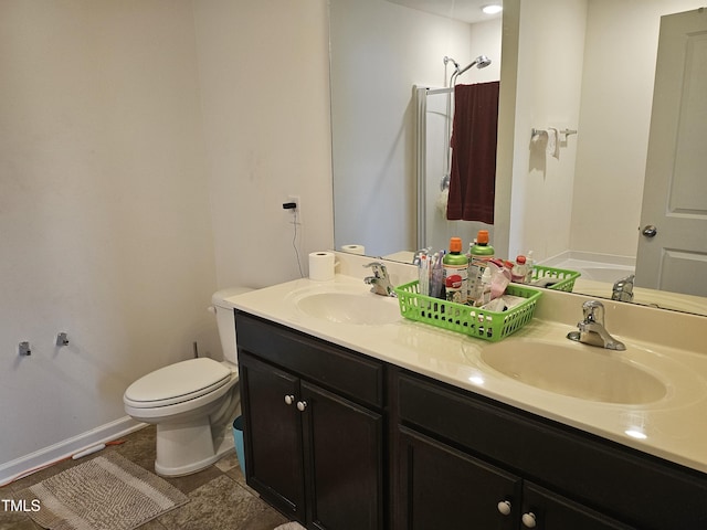 1303 Salters St, Burlington, NC 27215 - bathroom featuring double vanity and toilet