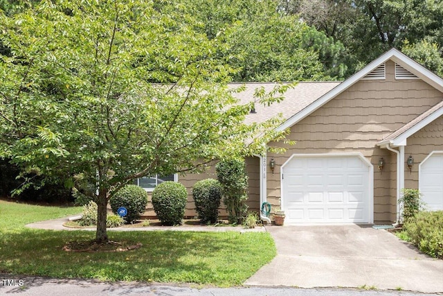 4201 Pin Oak Dr, Durham, NC 27707 - view of front facade featuring a garage, driveway, a shingled roof, and a front yard