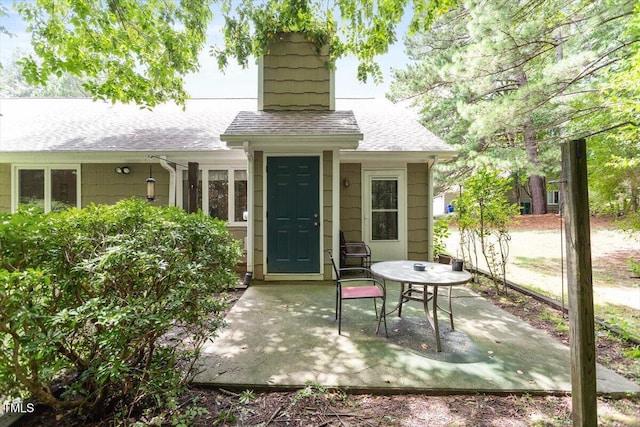 4201 Pin Oak Dr, Durham, NC 27707 - back of house featuring a patio and a shingled roof