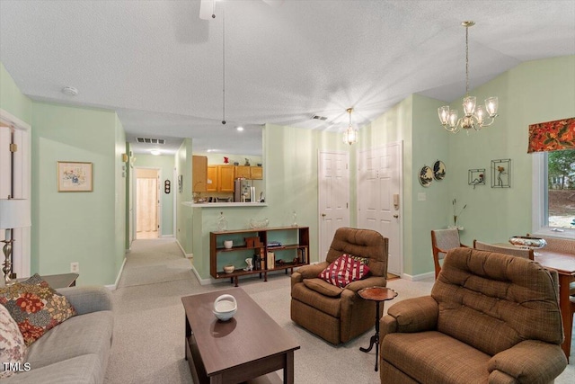 4201 Pin Oak Dr, Durham, NC 27707 - living area featuring light carpet, a chandelier, a textured ceiling, and lofted ceiling