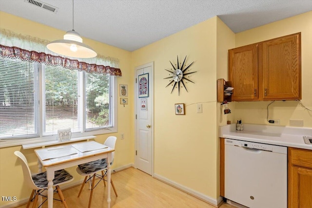 4201 Pin Oak Dr, Durham, NC 27707 - dining area with light wood finished floors, a textured ceiling, and an office area