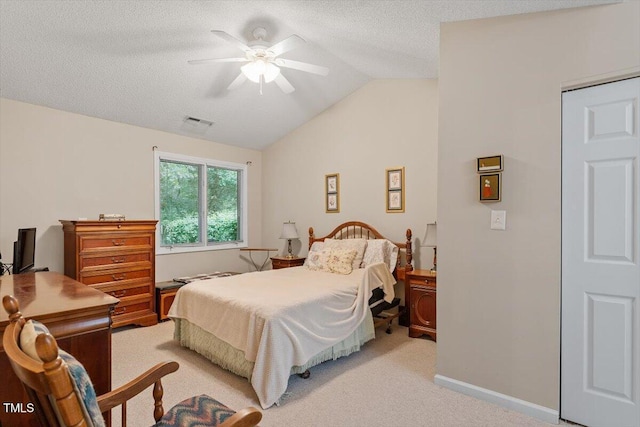 4201 Pin Oak Dr, Durham, NC 27707 - bedroom featuring lofted ceiling, light carpet, ceiling fan, and a textured ceiling