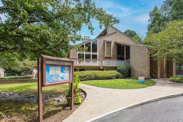 4201 Pin Oak Dr, Durham, NC 27707 - view of front of home with a deck and a front lawn