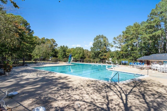 4201 Pin Oak Dr, Durham, NC 27707 - community pool with a patio area and view of scattered trees