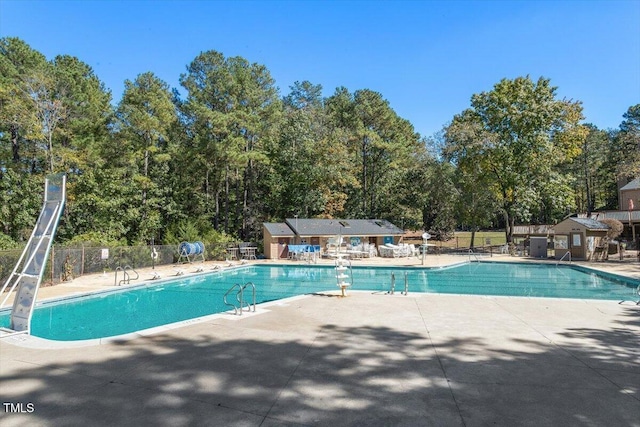 4201 Pin Oak Dr, Durham, NC 27707 - community pool featuring a patio and view of wooded area